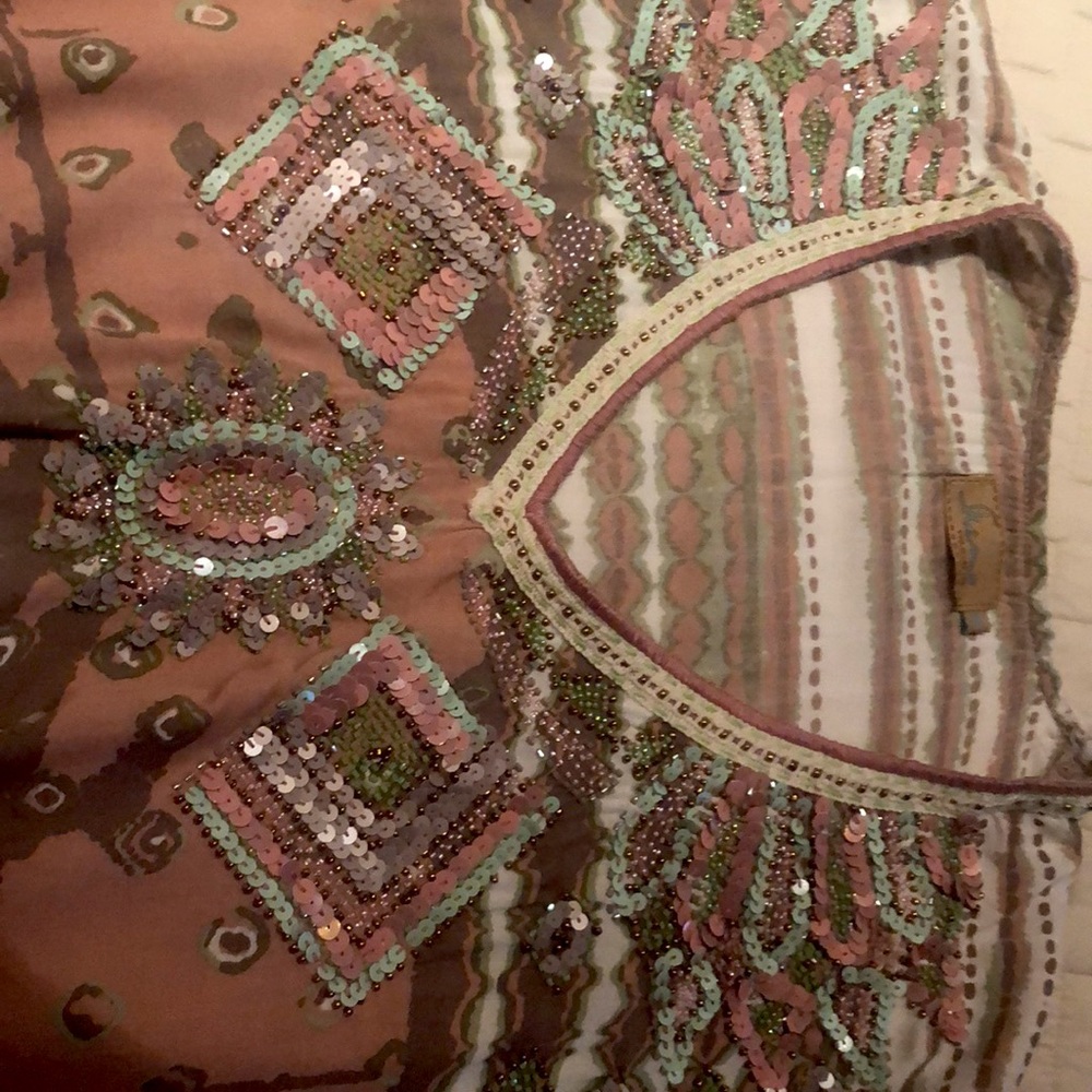 Ladies pull over beaded top. Size medium.